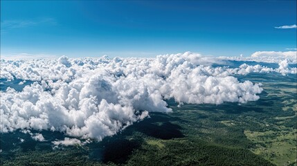 Clouds Floating Above Lush Green Landscape Under Blue Sky