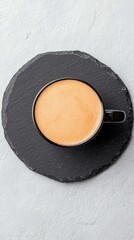 Coffee in Black Mug on Slate Plate, Overhead View