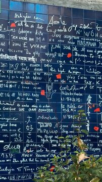 The Wall of Love, with the phrase I love you written in different languages, Montmartre, Paris, France, October 15, 2025. High quality 4k footage