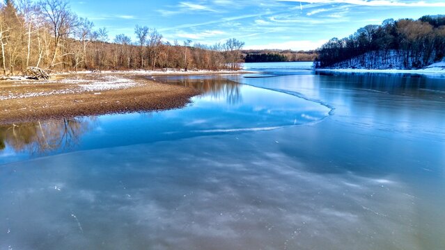 Calm, Half Frozen Lake during Early Winter