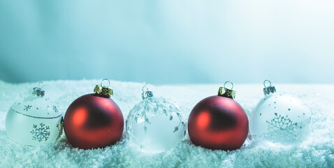 Christmas balls on snow background