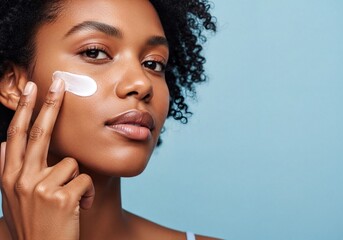 Young African American Woman Applying Face Skincare Cream for Healthy Glowing Skin
