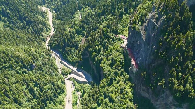 Altindere, Trabzon Province, Turkey. Sumela Monastery. Altindere Valley Park. Coniferous forest on the slopes. Aerial View, Departure of the camera