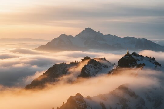 Mountain peaks rising above a sea of clouds at sunrise with snow-covered ridges and a small structure atop a summit