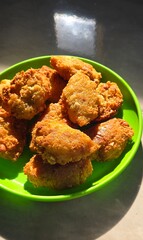 Fried grated cassava named combro in Bahasa in a plate 