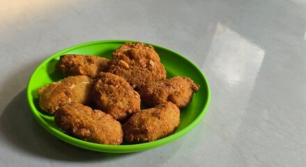 A plate of fried grated cassava named combro in Bahasa 