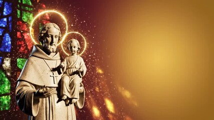 Feast of Saint Anthony banner video, statue of Saint Anthony holding infant Jesus illuminated with gentle halo glow, subtle falling light particles