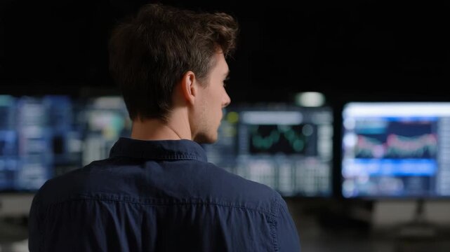 Financial Analyst Monitoring Stock Market Data on Computer Screens