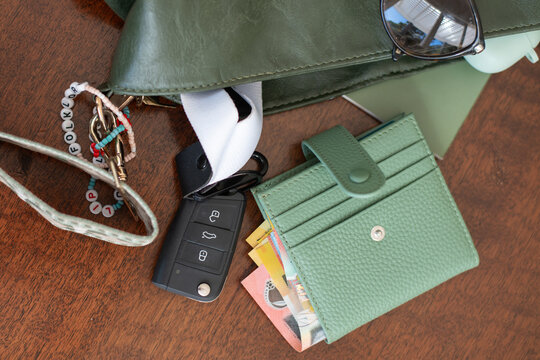 green wallet with Australian money and car keys