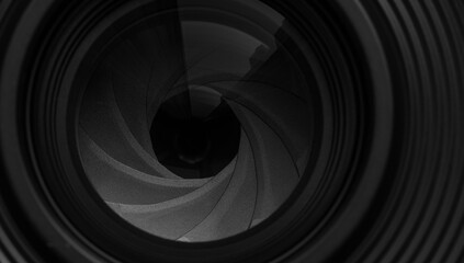 Close-up macro video camera lens,Photo Camera or Video lens close-up on black background DSLR objective,Mirrorless camera,Mirrorless camera lens aperture macro.
