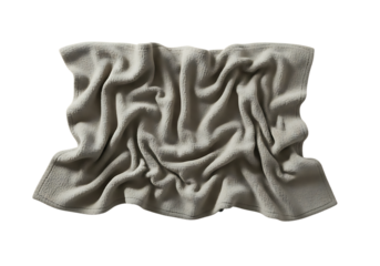 Crumpled beige terry cloth towel displaying fabric texture, soft folds and subtle shadows.