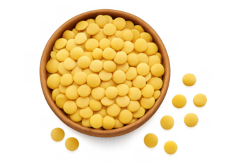 Yellow round pills filling wooden bowl and spilling onto a transparent background, medicine and healthcare concept
