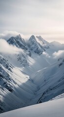 Majestic Snow-Capped Mountains Under a Softly Lit Sky.