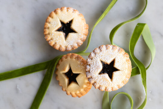 three baked fruit mince pies, a traditional christmas food