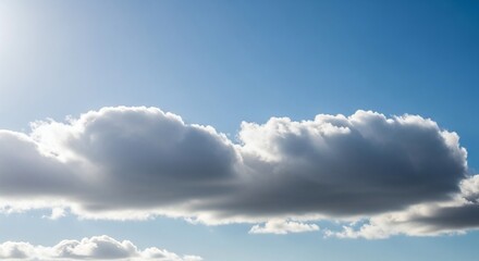 A fluffy cloud drifts serenely across a clear blue sky, illuminated by the suns gentle rays, creating a peaceful and picturesque scene