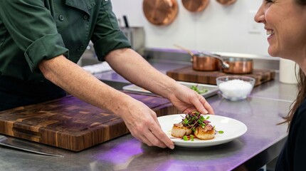 Professional chef serving garnished dish with microgreens in kitchen.