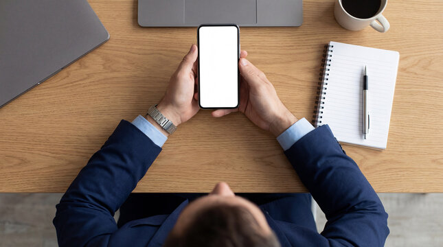 Top View of Businessman Holding Blank Screen Mockup Mobile Phone