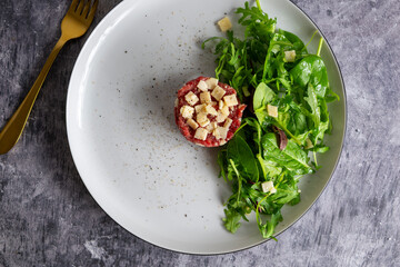 Beef Carpaccio cold appetizer with parmesan