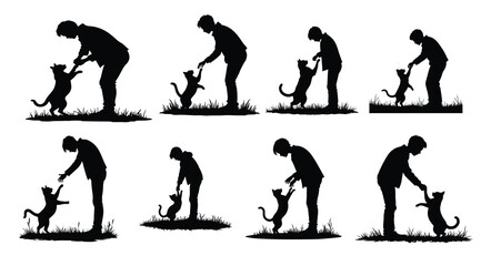 Black silhouettes of people and cats playing on grass