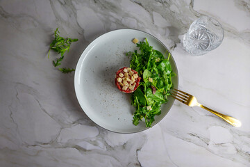 Beef Carpaccio cold appetizer with parmesan