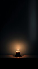 A serene image of a single candle illuminating a calm, dark room, creating a peaceful ambiance perfect for relaxation.