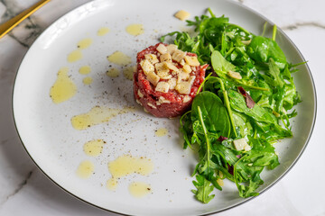 Beef Carpaccio cold appetizer with parmesan