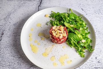 Beef Carpaccio cold appetizer with parmesan