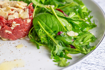 Beef Carpaccio cold appetizer with parmesan
