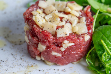 Beef Carpaccio cold appetizer with parmesan