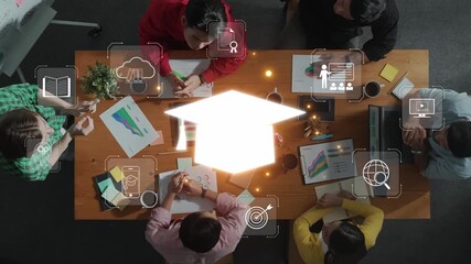 An overhead view of a diverse team in a modern workspace, engaged in a collaborative session, discussing educational projects with digital concepts and tools. Raster - Powered by Adobe