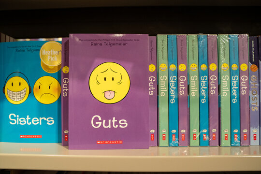 Close up of Guts book by Raina Telgemeier on store shelf. Toronto, Canada - December 3, 2025.