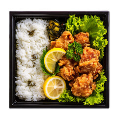 Traditional Japanese bento box with white rice, fried karaage chicken, pickles, lemon, and lettuce