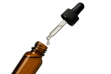 Essential oil dropping into a glass bottle, clear liquid serum for natural beauty and skincare treatment