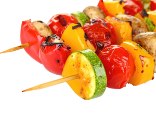 Close-up of grilled vegetable skewers with colorful peppers, tomatoes, zucchini, and mushrooms