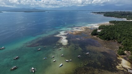 Aerial view of boats in shallow turquoise water Puerto Princesa