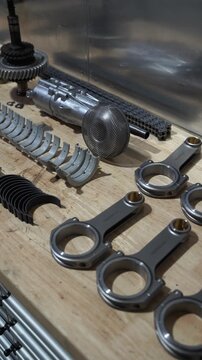 Performance car parts arranged on workshop bench in a garage