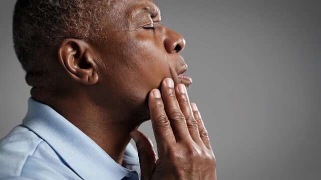 Concerned Black Man Touching Face in Portrait, Expression of Pain or Anxiety Focus