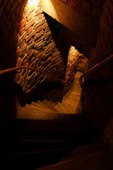 Historic buildings among green trees in a European city. A panoramic bird's-eye view of the historic city from the window of a tall old castle. June 1, 2025, Vilnius, Lithuania.