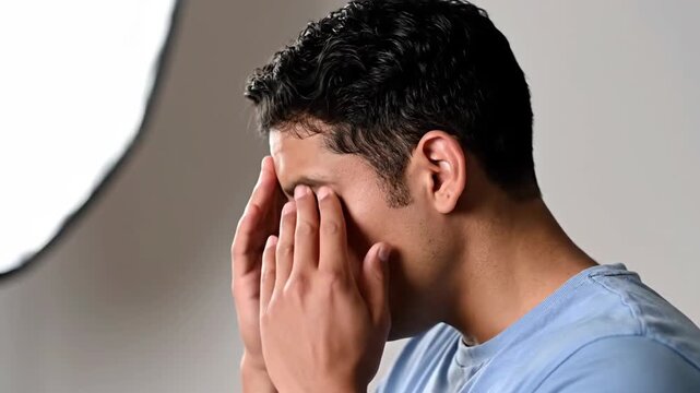 Man Experiencing Allergic Reaction or Respiratory Issue and Seeking Relief Indoors