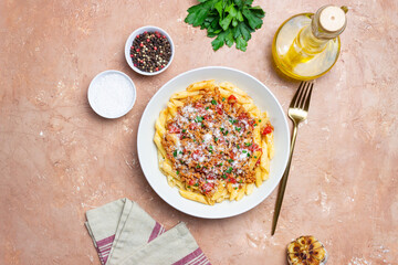 Pasta with bolognese sauce and cheese. Italian cuisine. Traditional recipe.