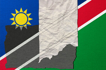 Naklejka premium A stylized image features the national flag of Namibia crafted from textured paper, creating a visually striking and symbolic representation of the country.