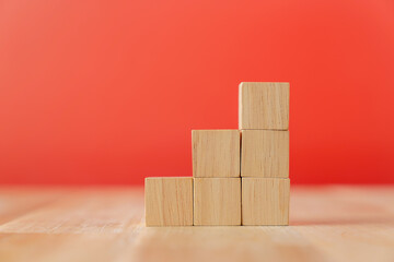 Obraz premium Wooden blocks forming a stair step growth concept.