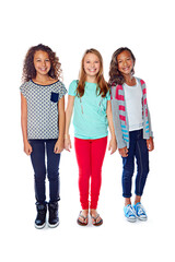 Obraz premium Happy, fashion and portrait of girls in studio with smile, confidence and style for friendship. Childhood, preteen and kids with trendy clothes, outfit and together on white background for bonding
