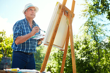 Painting, canvas and thinking with old man in nature for creative project, inspiration and garden drawing. Retirement, artist and easel with senior person outdoor for botanical artwork and vision