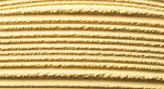 Closeup abstract view of parallel textured lines in golden sand, creating a natural pattern and background
