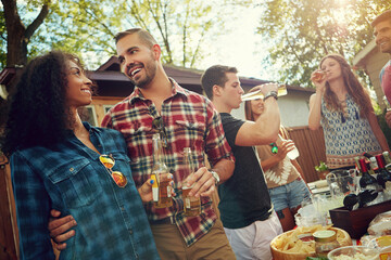 Couple of friends, laugh and beer in backyard, party and cookout at reunion, talk or weekend. People, group and happy outdoor for drinks, alcohol or lunch at social gathering on holiday in summer