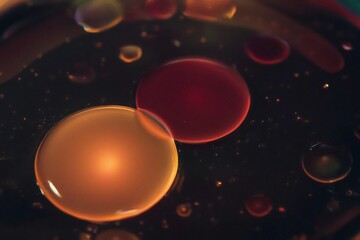 Hypnotic Fluid Motion: Large Amber and Red Blobs in a Lava Lamp Style Abstract Background