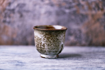 Traditional japanese ceramic on rustic wooden background. Soft focus. Copy space.	