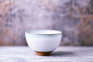 Traditional japanese ceramic on rustic wooden background. Soft focus. Copy space.	