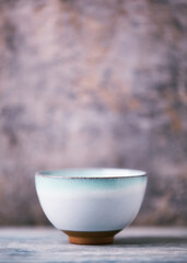 Traditional japanese ceramic on rustic wooden background. Soft focus. Copy space.	